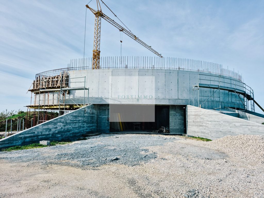 Curved concrete structure of the Ocean View Villa under construction on the Silver Coast
