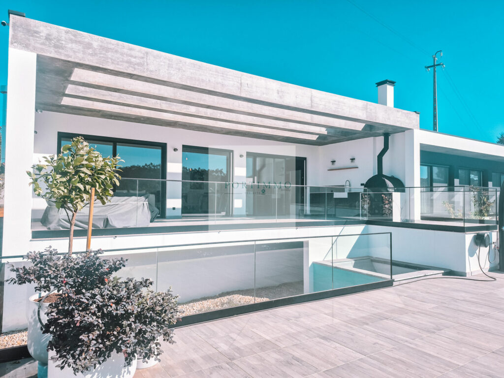 Covered terrace and pool terrace of the contemporary villa