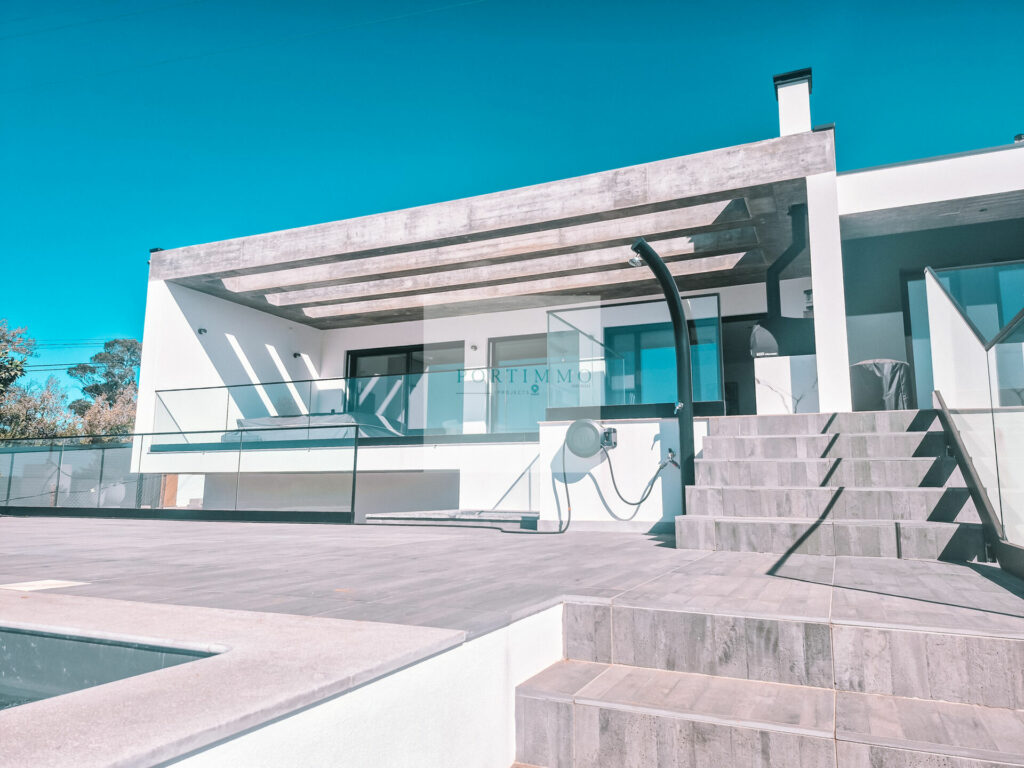 Steps from the pool terrace to the covered terrace