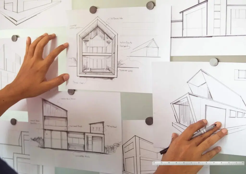 Architectural sketches of a house design on a planning board