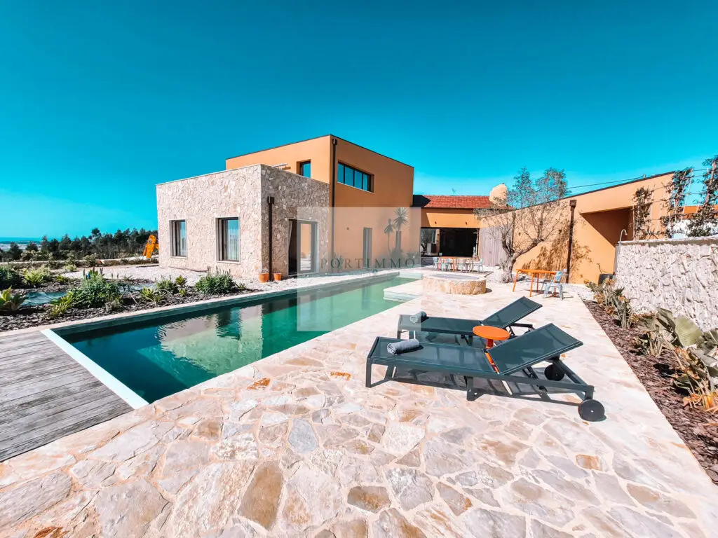 Completed villa with natural stone terrace and swimming pool